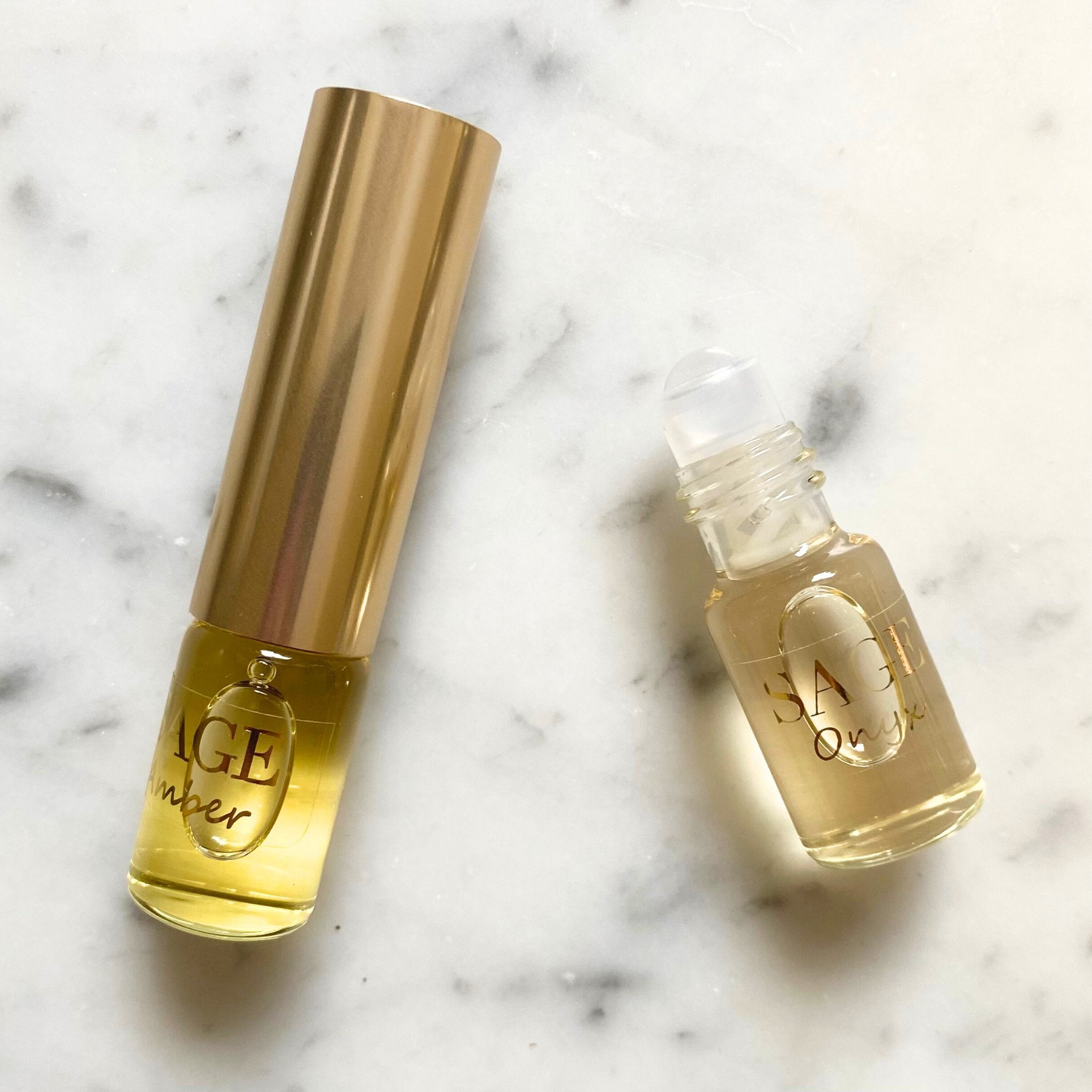 Onyx & Amber Organic 1/4 oz Eau de Toilette Dual Roll with cap removed to show roll on detail