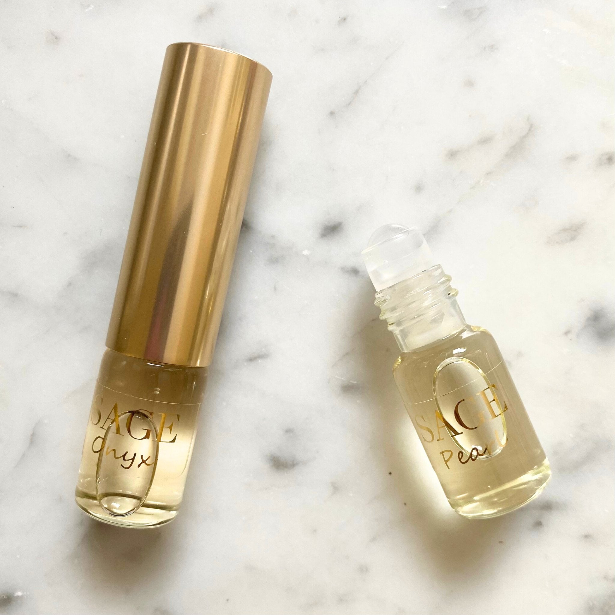 Onyx & Pearl Organic 1/4 oz Eau de Toilette Dual Roll with cap removed to show roller detail