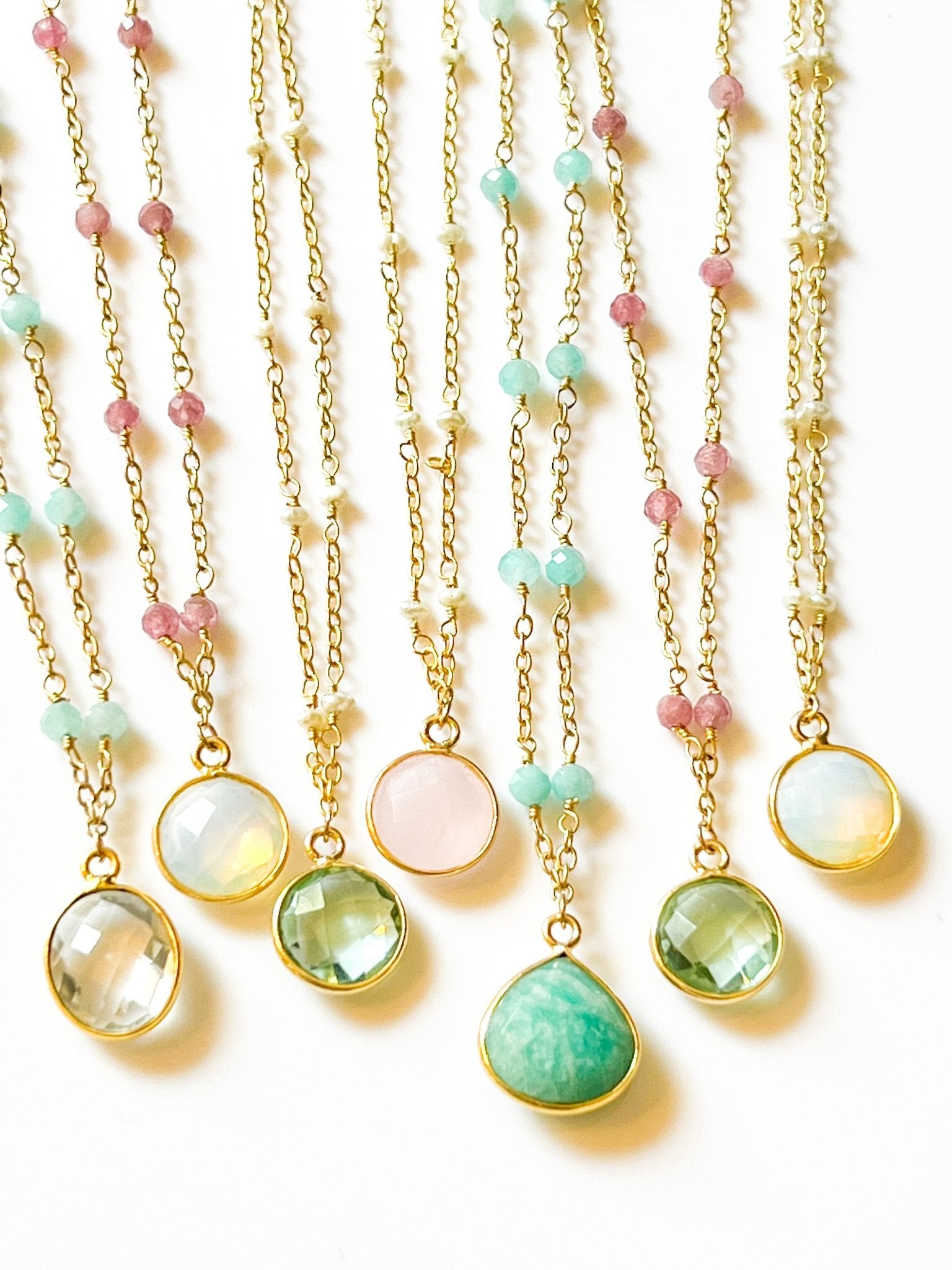 Blue Topaz Charm Drop Gold Necklace on Pink Tourmaline by Sage Machado - The Sage Lifestyle