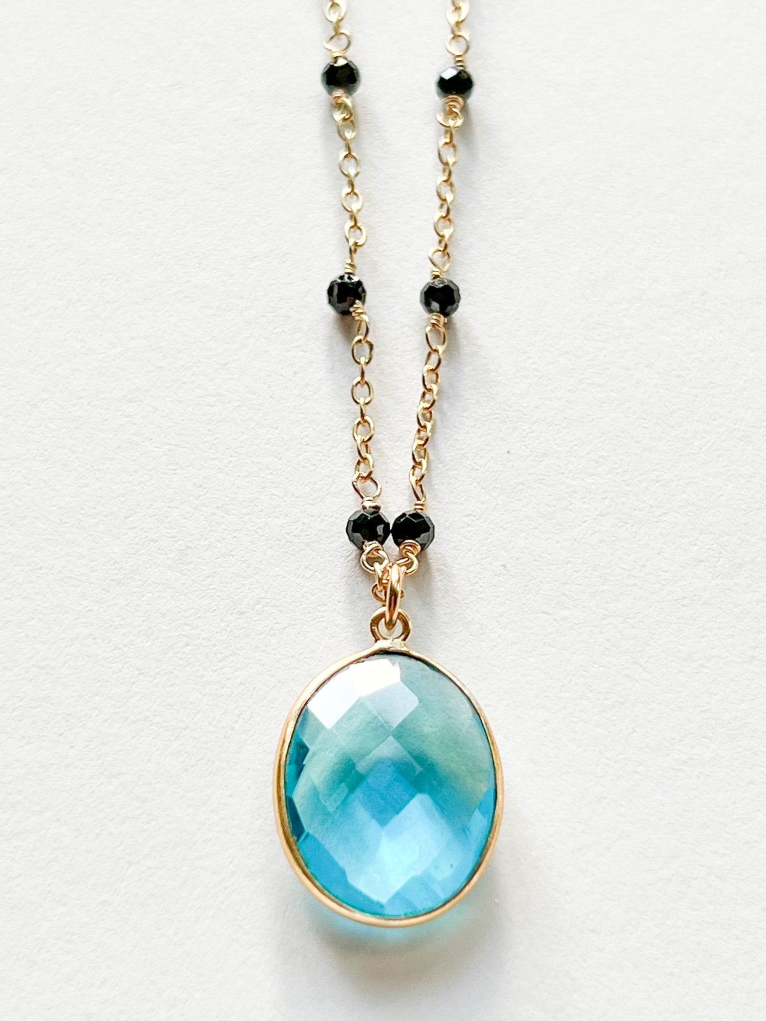 Blue Topaz Large Oval Pendant Necklace on Gold Chain with Black
