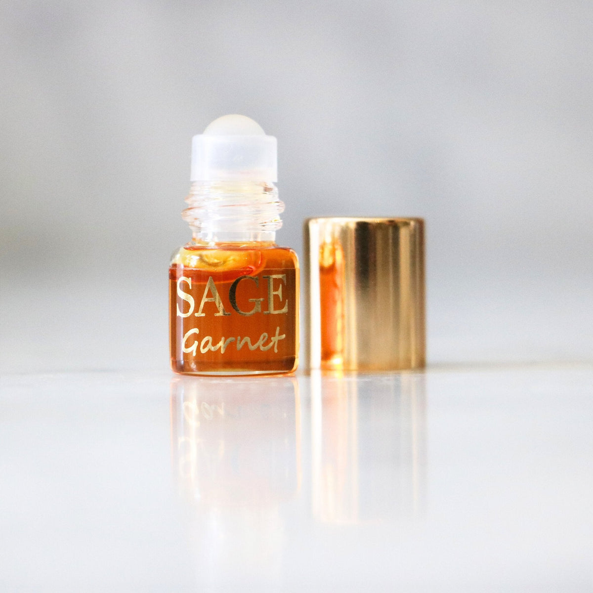 03oz Mini Roll on Sage Garnet Perfume Oil, Earthy, dark floral, Gender Neutral Vegan,Cruelty Free, and travel-size fragrance