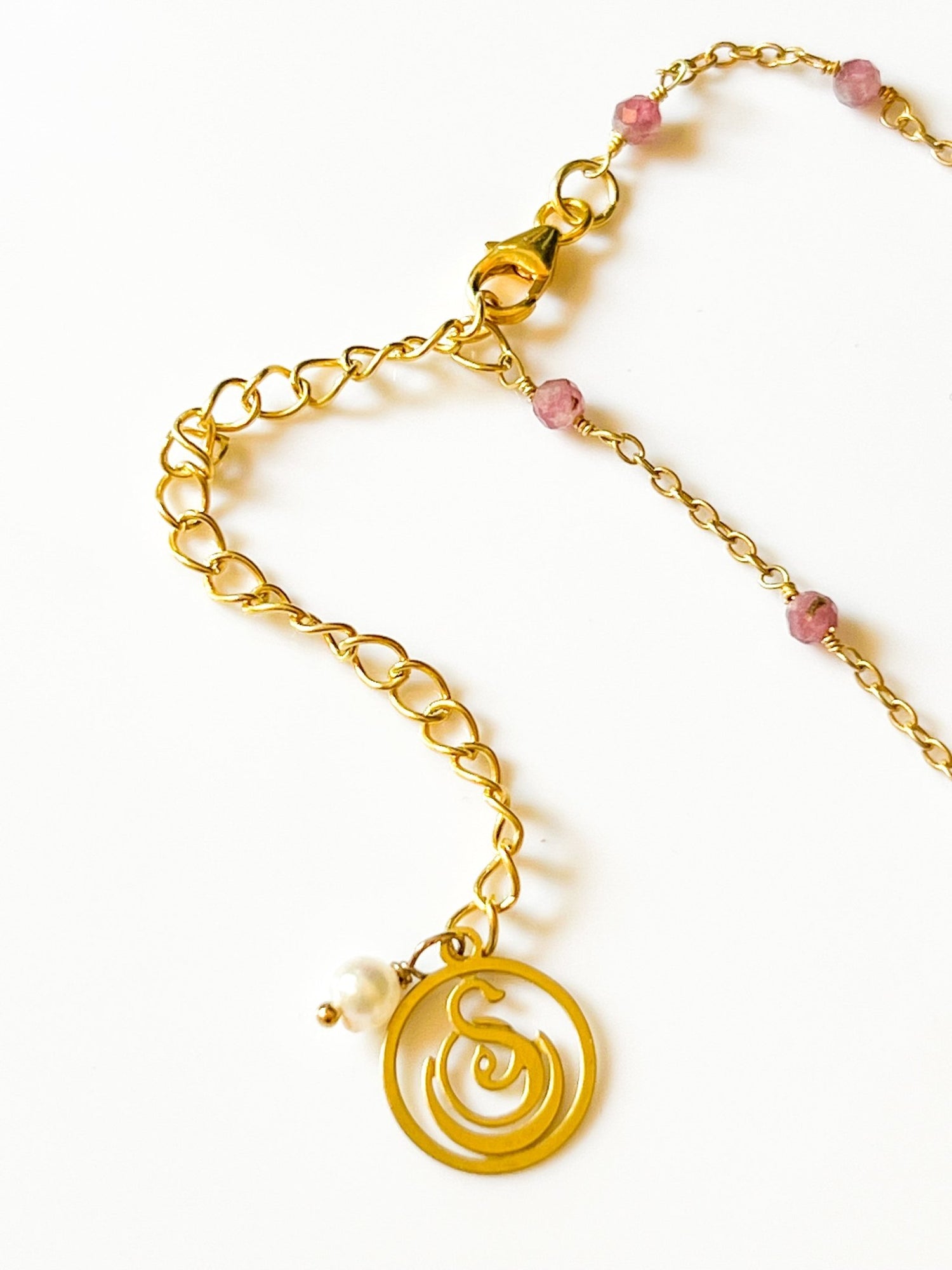 Blue Topaz Charm Drop Gold Necklace on Pink Tourmaline by Sage Machado - The Sage Lifestyle