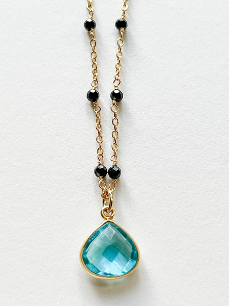 Blue Topaz Teardrop Charm Necklace on Gold Chain with Black Onyx by Sage Machado - The Sage Lifestyle