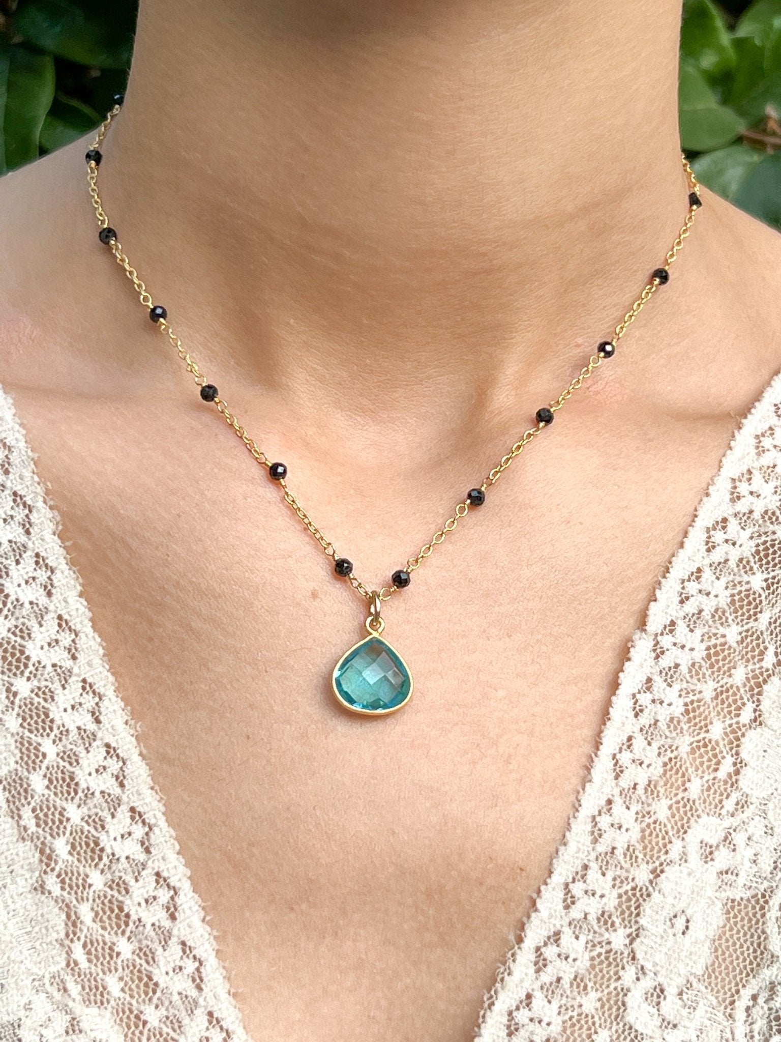 Blue Topaz Teardrop Charm Necklace on Gold Chain with Black Onyx by Sage Machado - The Sage Lifestyle