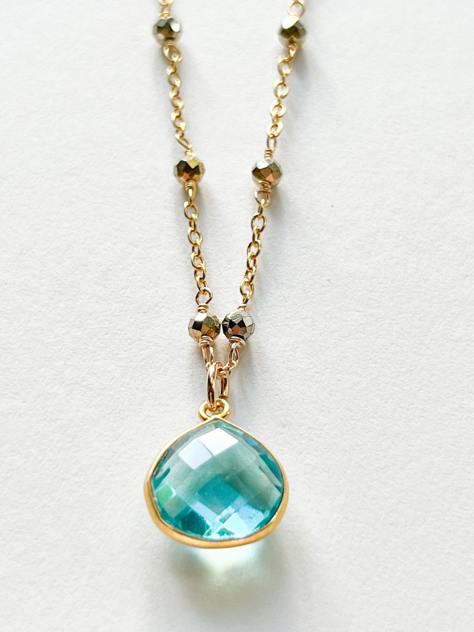 Blue Topaz Teardrop Charm Necklace on Gold Chain with Golden Pyrite by Sage Machado - The Sage Lifestyle
