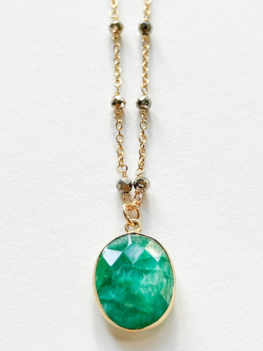 Raw Emerald Large Oval Pendant Necklace on Gold Chain with Golden Pyrite by Sage Machado - The Sage Lifestyle