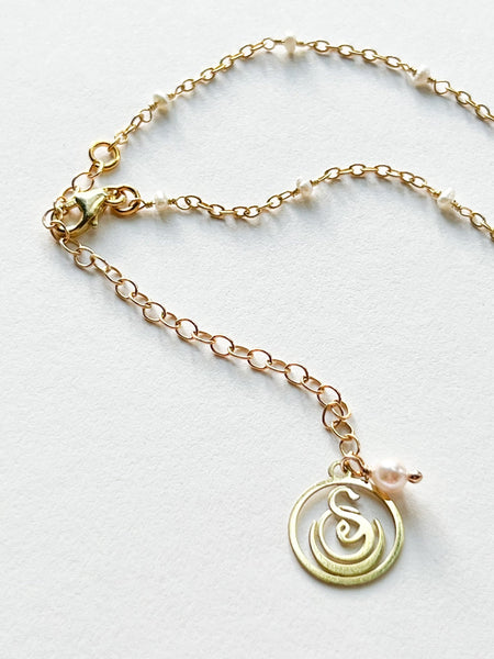 Rock Quartz Crystal Round Charm Necklace on Gold Chain with White Freshwater Pearls by Sage Machado - The Sage Lifestyle